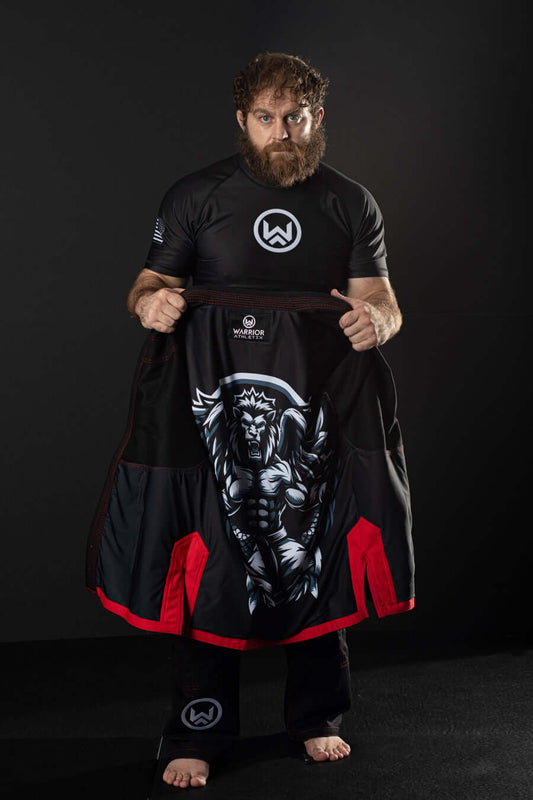 Man holding Lion of Judah Gi Jacket with Lion of Juda design inside. 